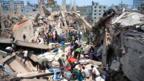 Bangladeshi civiliant volunteers assist in rescue operations after an eight-storey building collapsed in Savar, on the outskirts of Dhaka