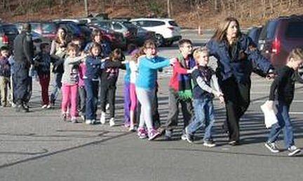 Children leave Sandy Hook School in Newtoen, Connecticut 14 December 2012