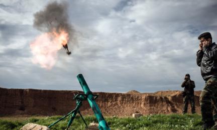 Syrian rebels fire a mortar in Al-Bab, 30km from the Syrian city of Aleppo on 14 February 2013