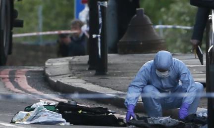 Police gather evidence at scene of Woolwich incident