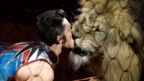 Animal trainer Alexander Lacey performs with Maasai the lion