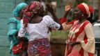 Relatives of the rescued Chibok girls greet each other as they wait to be reunited with their children in Abuja, Nigeria May 20, 2017.
