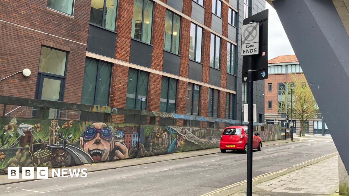 Assembly Rooms Lane in Bristol on an overcast day.