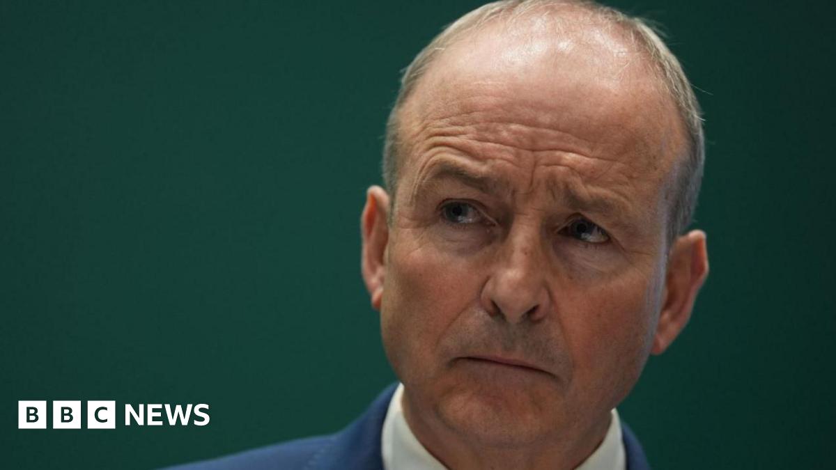 Micheál Martin, a man with grey hair, a blue jacket and white shirt.