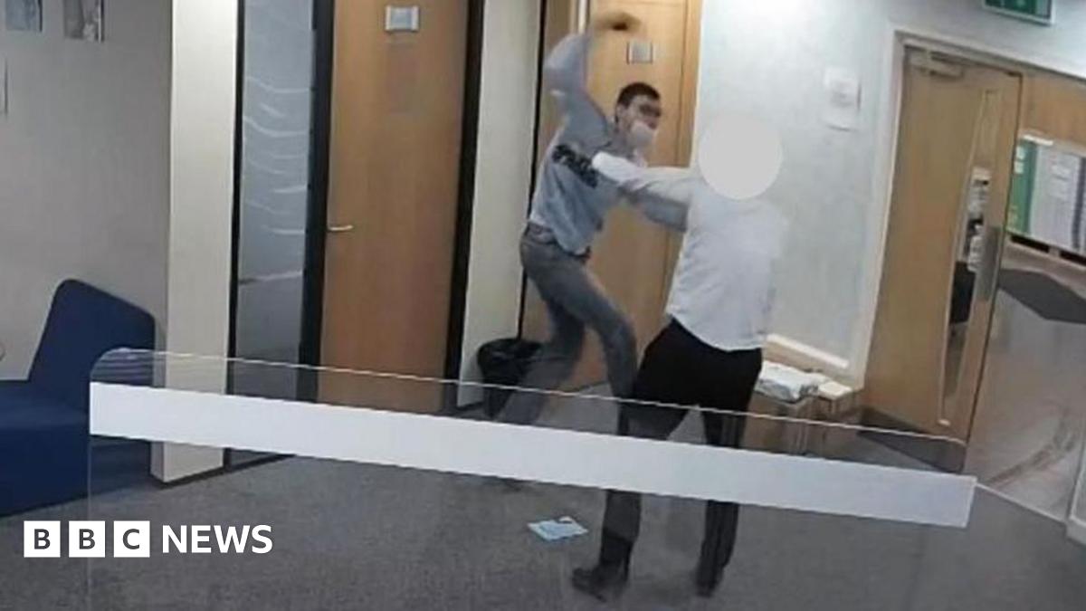 Cavan Medlock armed with a knife launches himself at a member of staff in the reception area of a law firm. There are doors in the background and a privacy screen in the foreground
