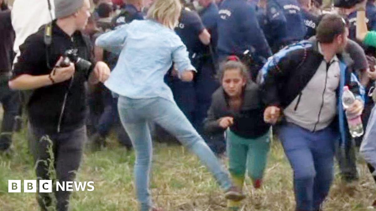 Migrant crisis: Hungarian camerawoman apologises for kicking migrants