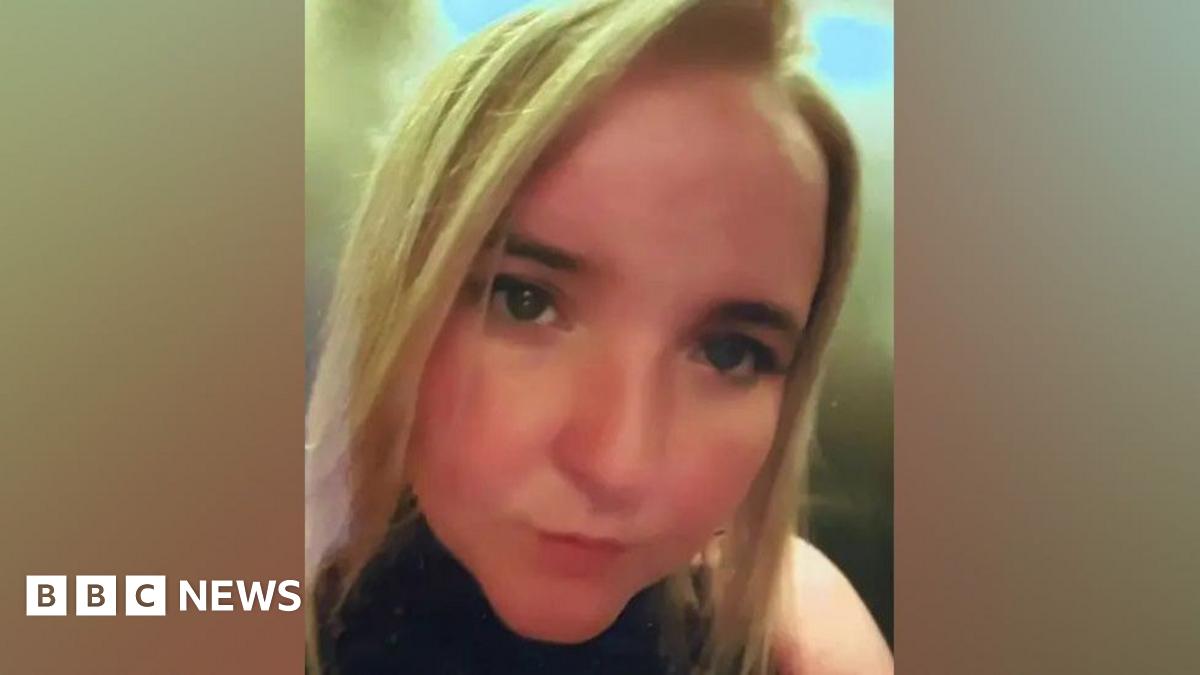A blonde Natalie looks to camera in a selfie 
