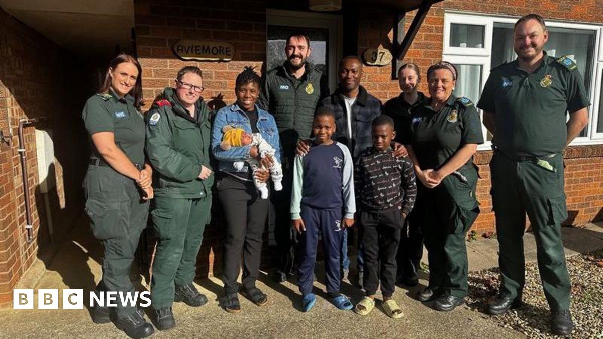 Corby mum is reunited with life-saving ambulance crew