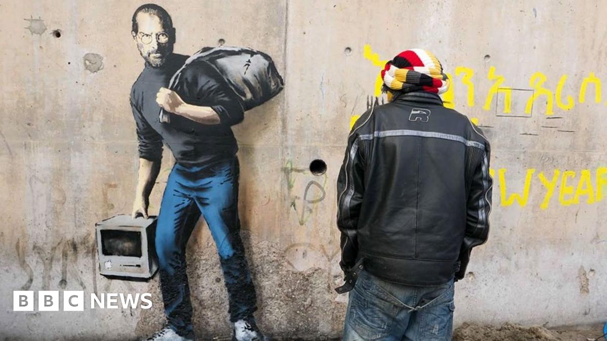 Banksy work in Calais 'Jungle' shows Steve Jobs as migrant - BBC News