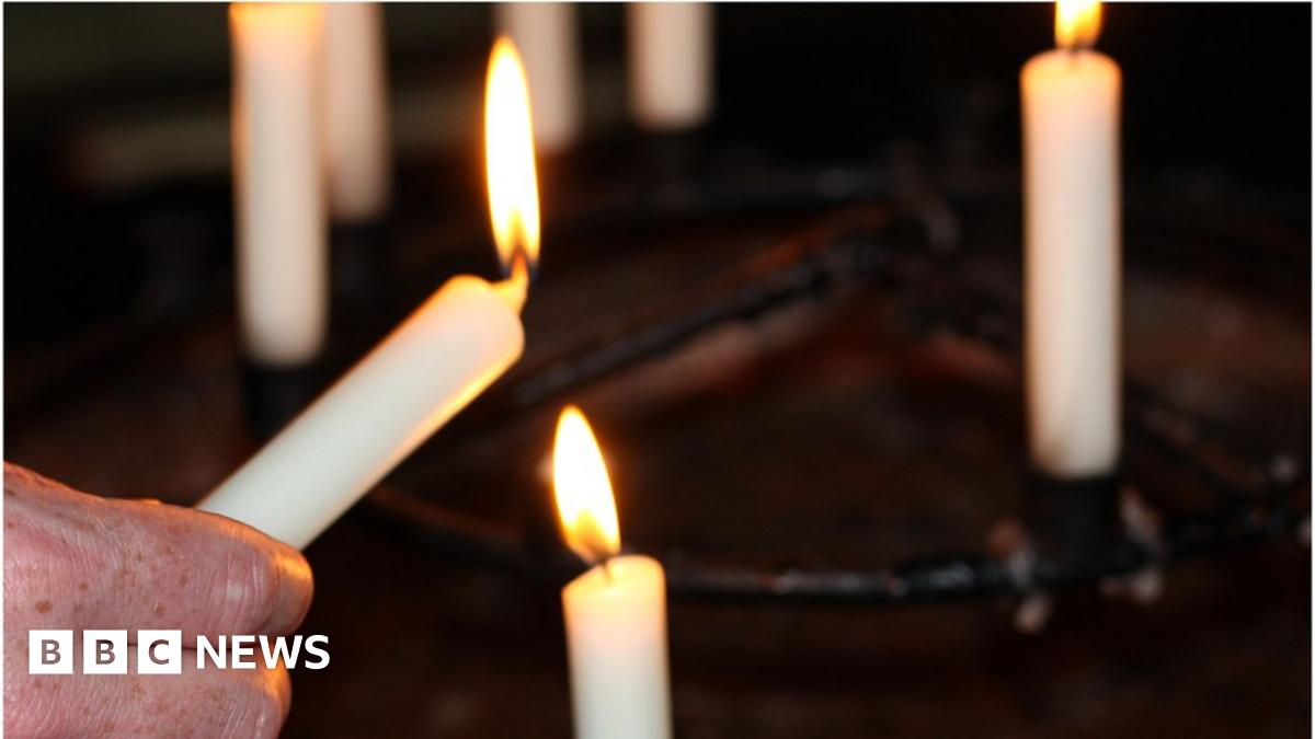 Lit candles in church