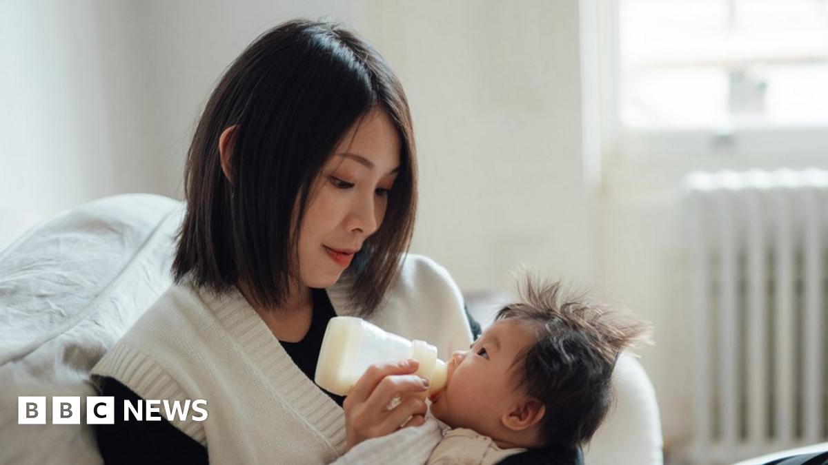 Baby being fed by mum