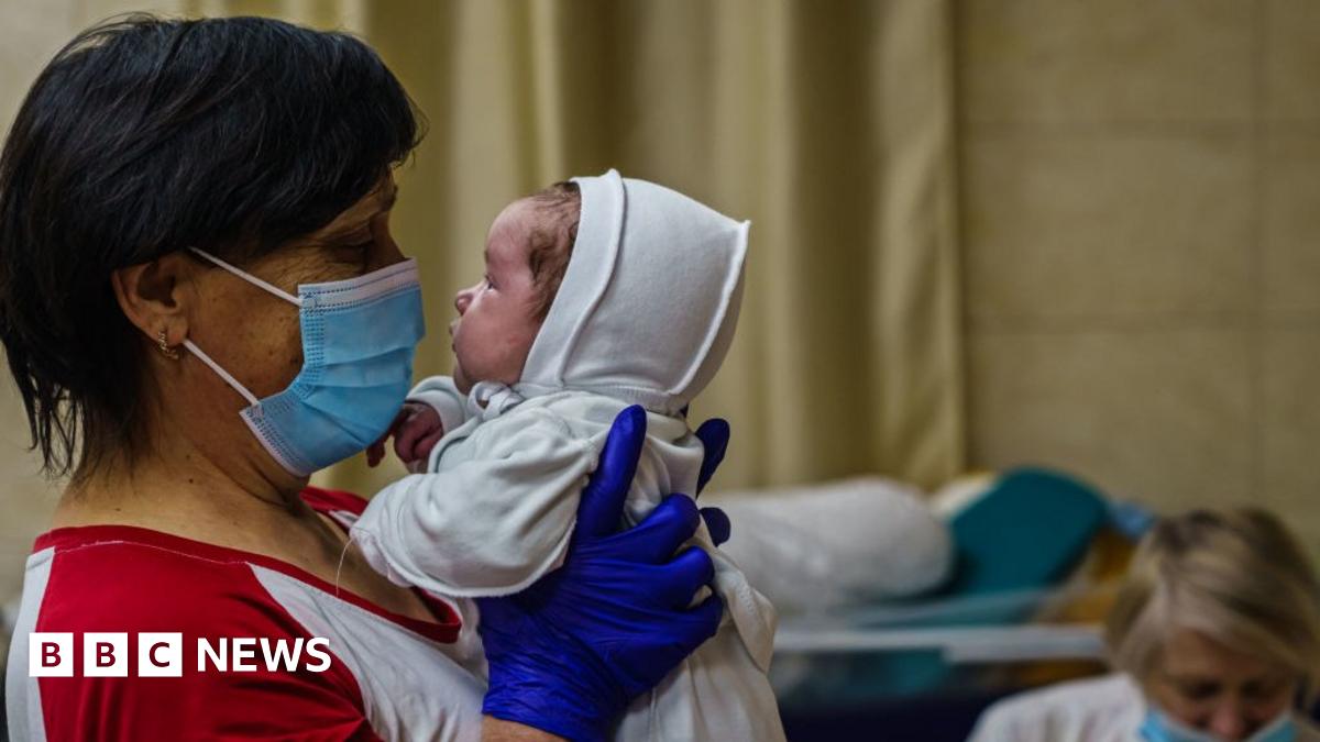 A nurse with a baby in Kyiv's underground nursery