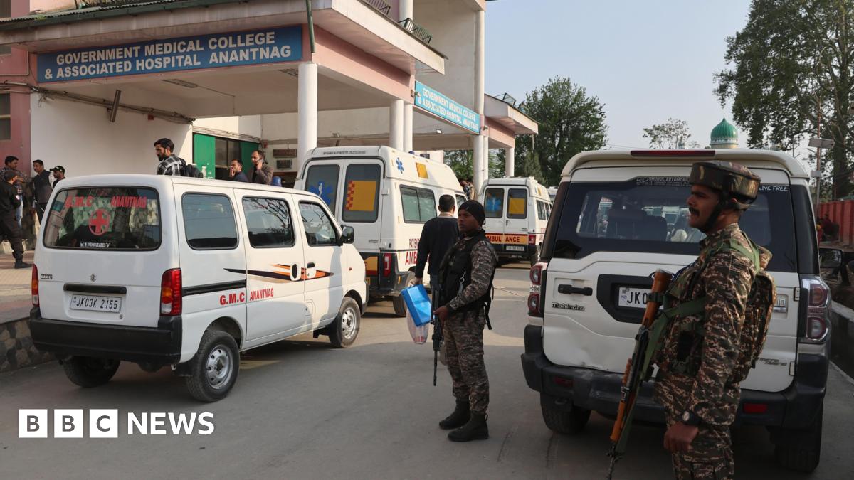 Security forces stand outside the government hospital in Anantnag, south of Srinagar