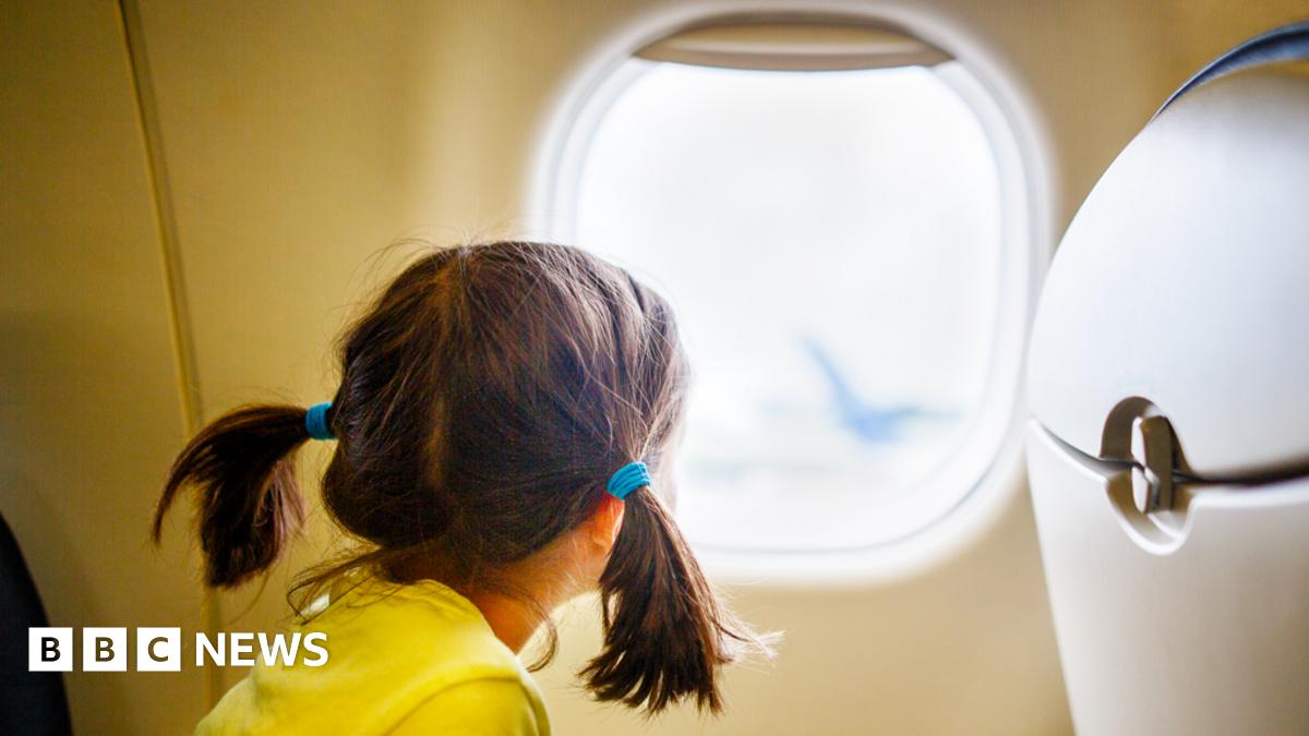 Child looking out of an aircraft window