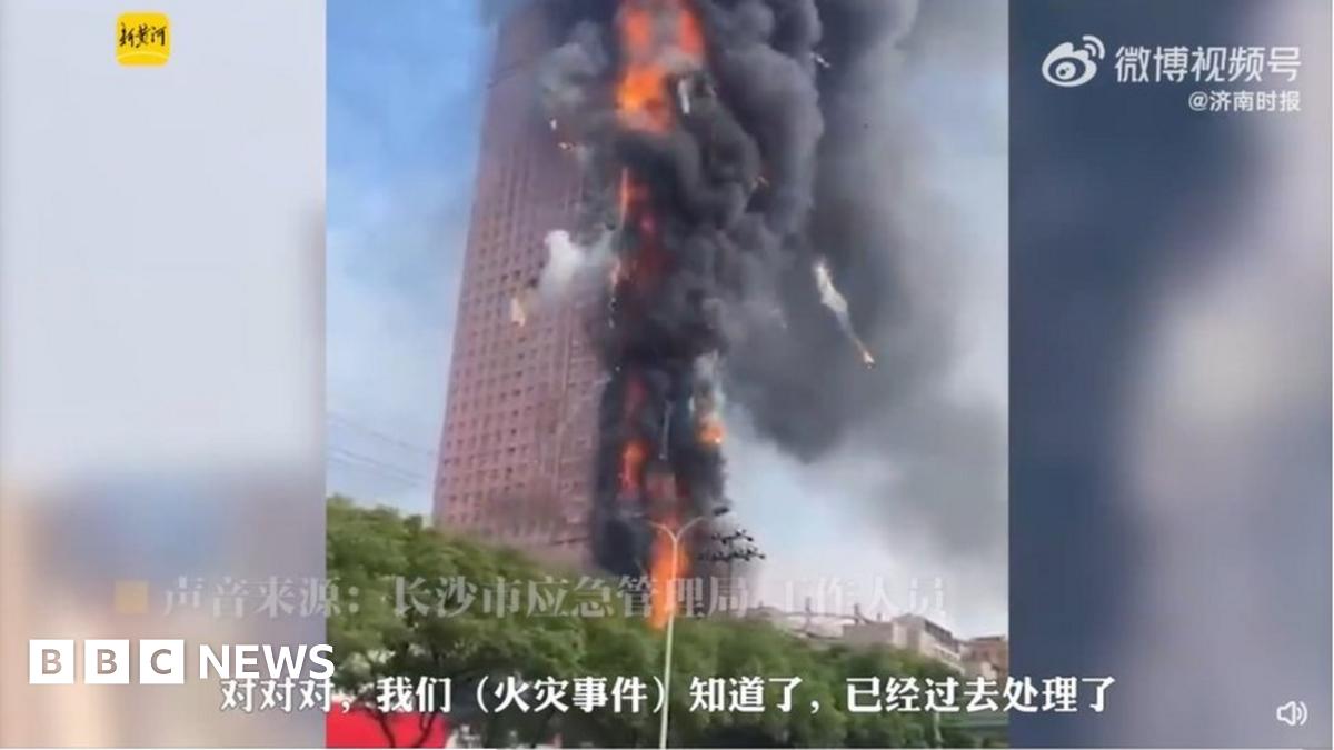 China fire: Skyscraper engulfed in massive flames - BBC News