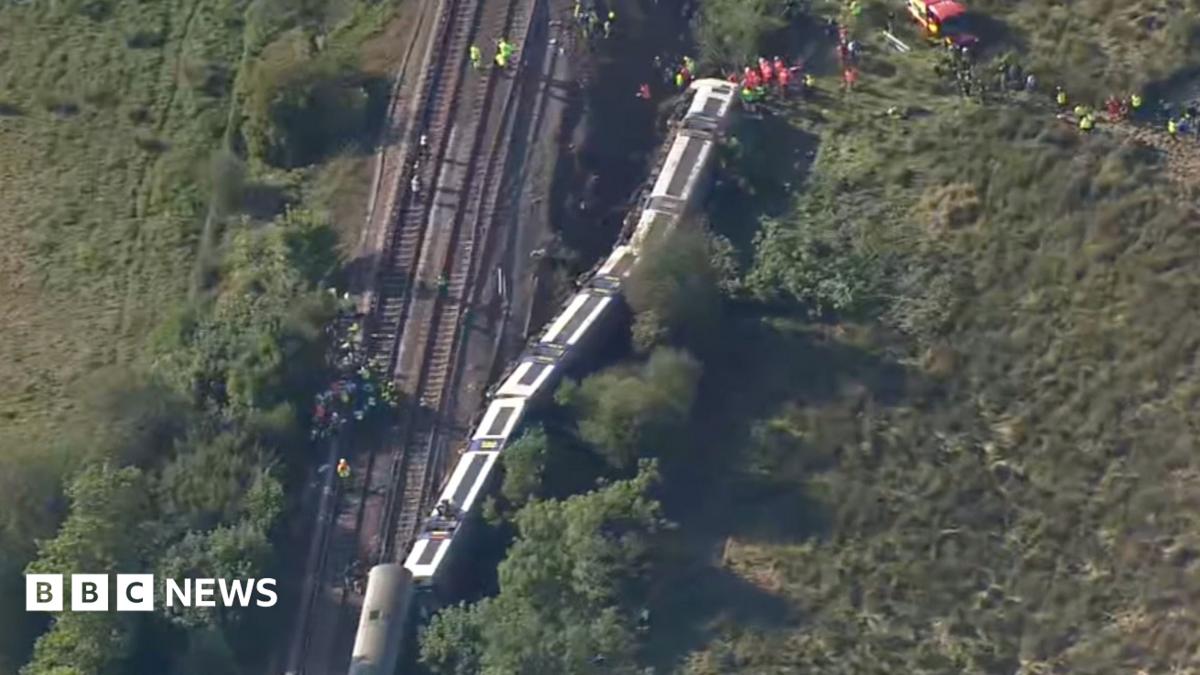 Aerial footage shows derailed train