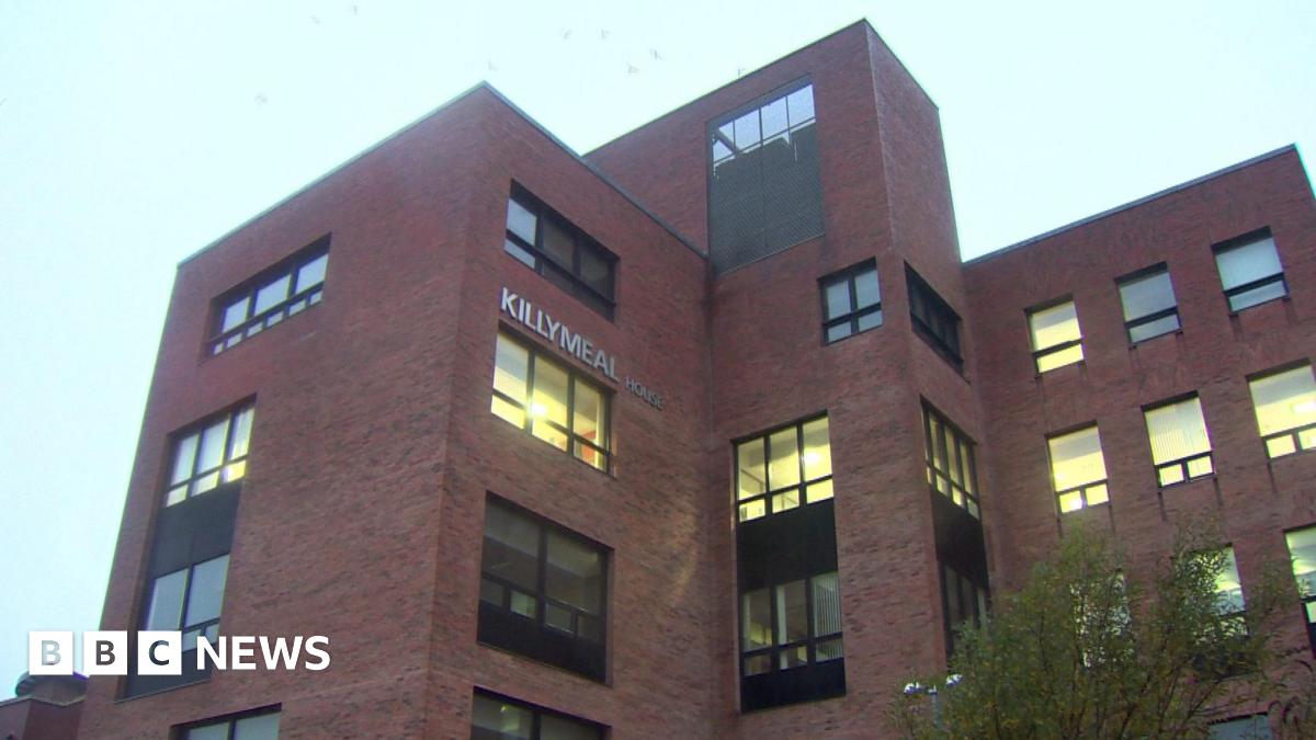 A red brick building with the windows and the words KILLYMEAL HOUSE in silver lettering on the side. 