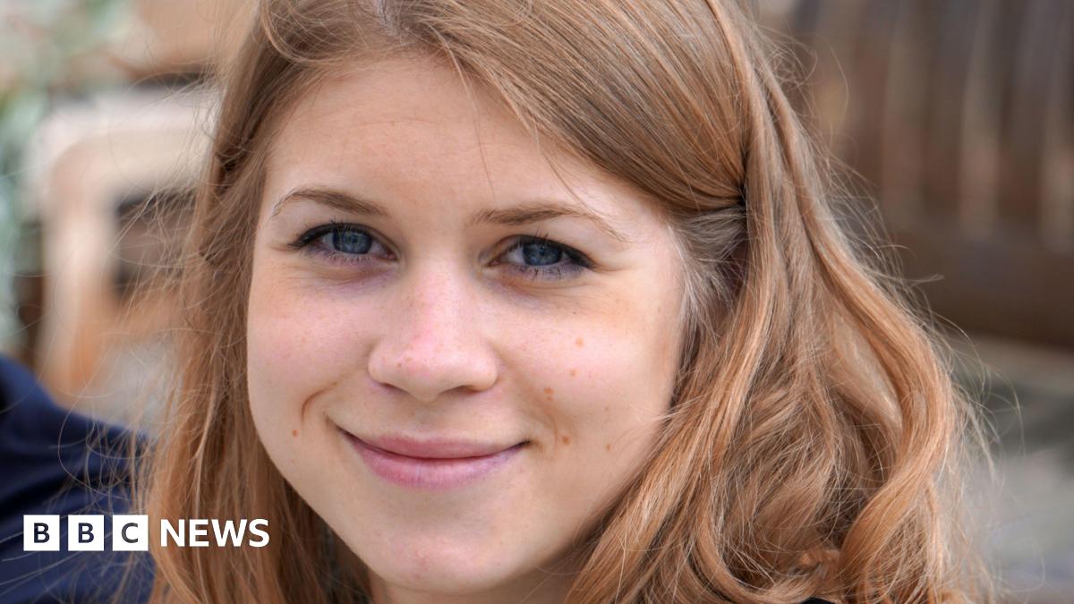A close-up photograph of Sarah Everard, a young woman with brown hair, smiling at the camera.