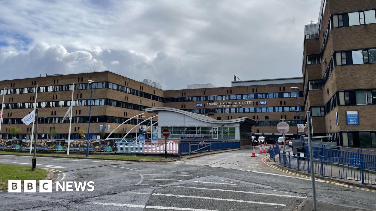 Exterior shot of the Queens Medical Centre - a large four storey building consisting of square blocks
