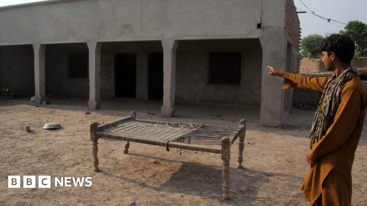 A Pakistani villager points to a house where a teenaged girl was raped in the neighbourhood of Raja Ram in Muzaffarabad