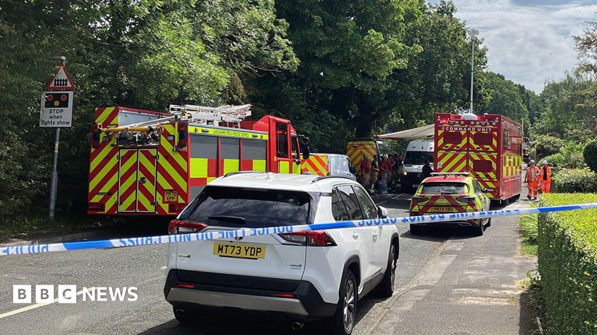One dead and child injured as train hits car at level crossing