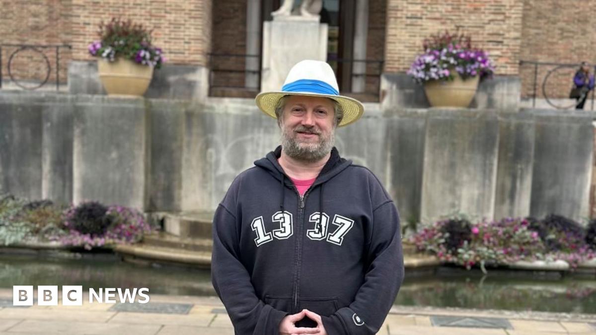A man standing in front of Bristol's City Hall