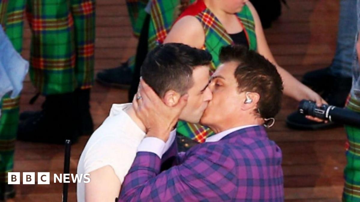 Two men kissing