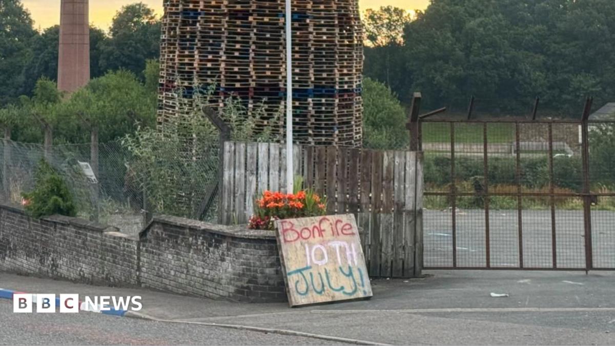 Bonfire with mosque replica placed on top set alight