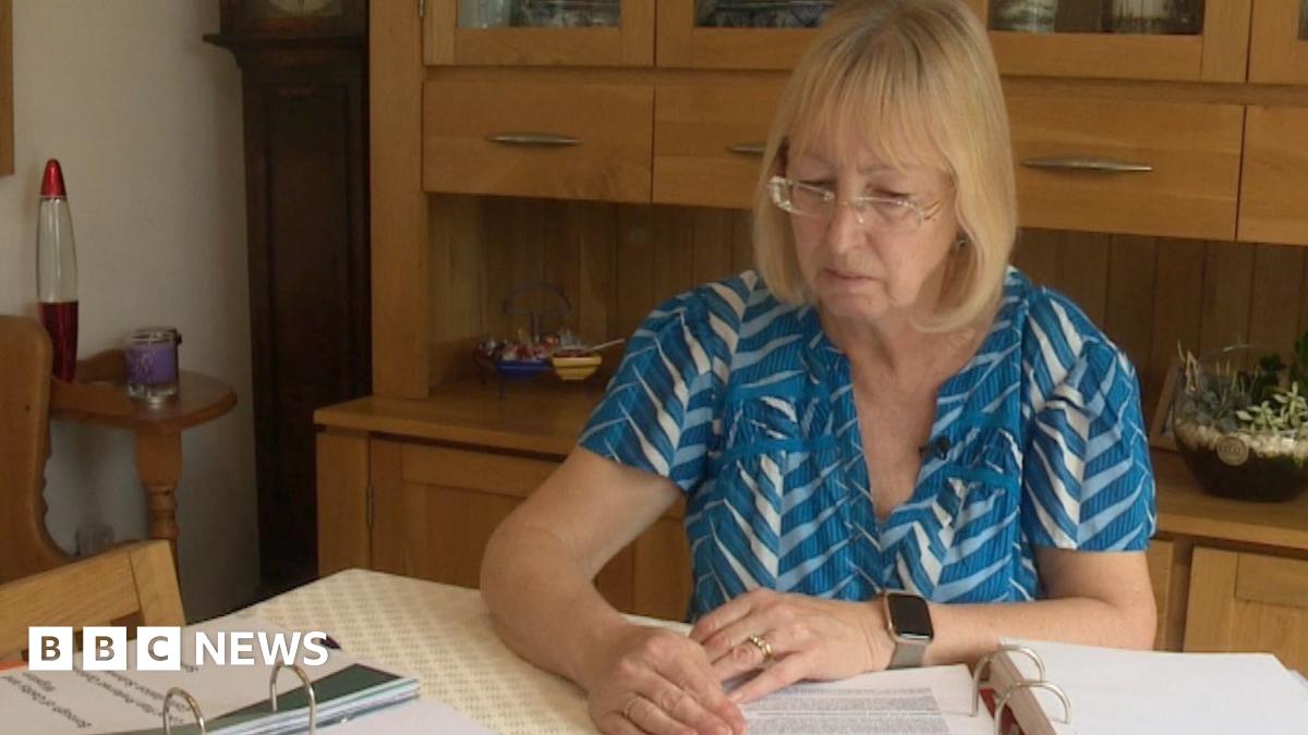 Karen sat at her desk looking over her paperwork for her home