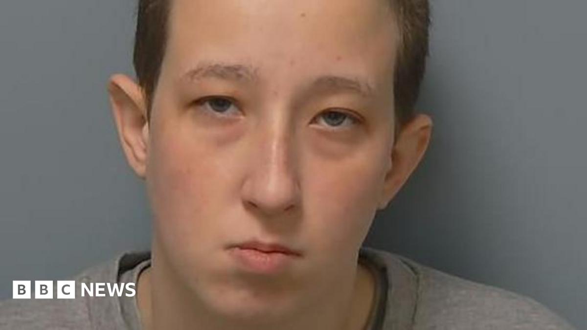 Anarlyn Jones has closely cropped hair in this police mugshot.