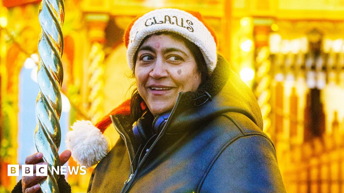 A picture of Gurinder Chadha in a Santa hat