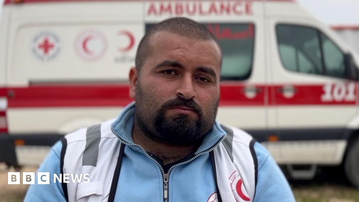 Paramedic Munther Abed sits in front of a Palestinian Red Crescent ambulance in Gaza 