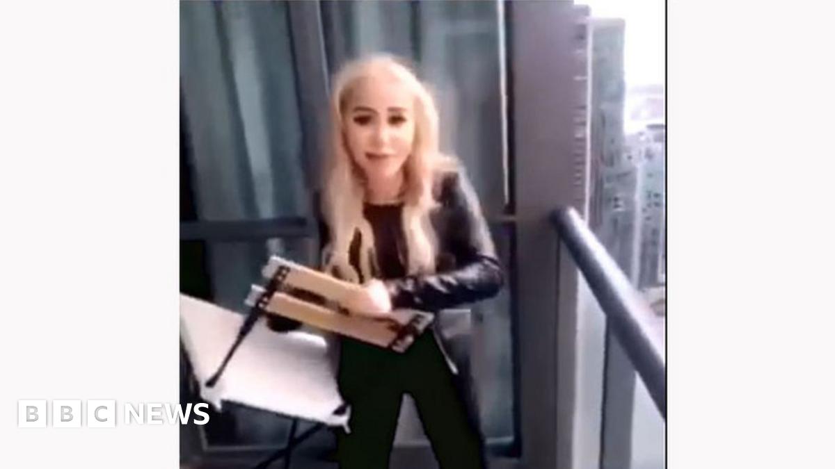 Police charge woman who threw chair from balcony onto highway BBC News