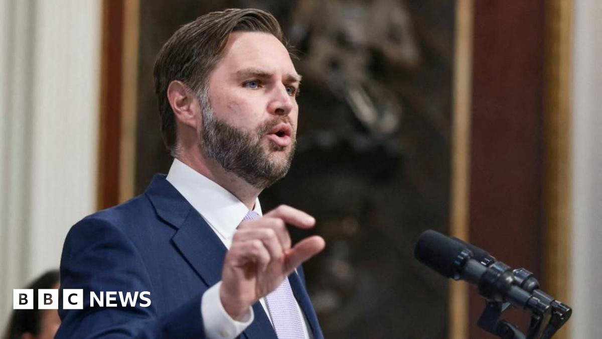 JD Vance speaking into a microphone. 