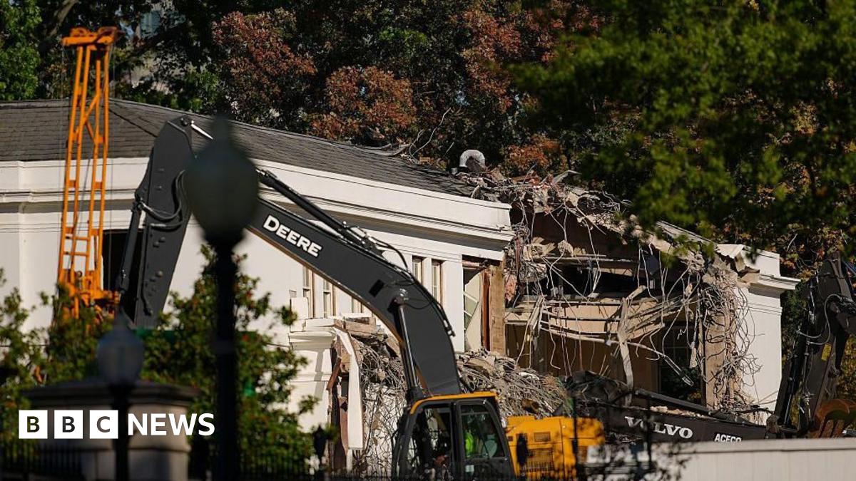 Construction equipment on the east side of the White House, with building debris visible in the foreground
