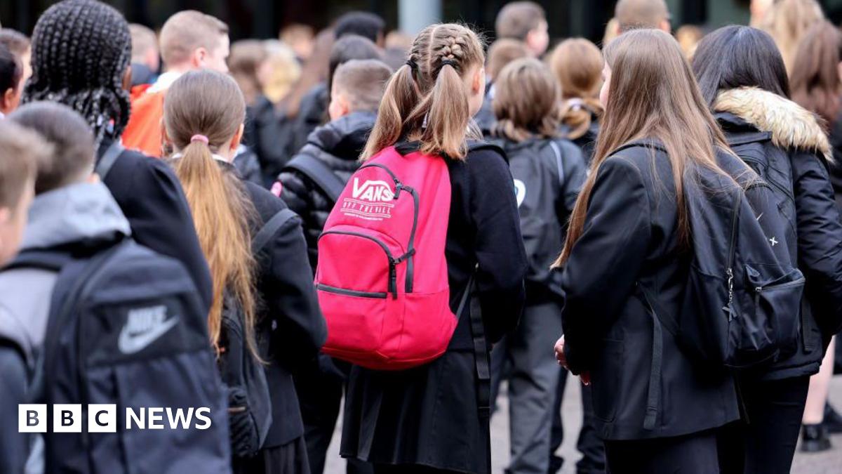 Pupils at St Paul's High School in Glasgow. A general view of high school pupils in the playground of the school, waiting to start the day.
