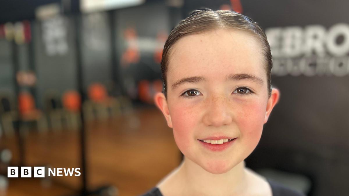 Photo: bbc.co.uk Ten year old Martha is looking at the camera, she is fair skinned with freckles and her hair is in a tight bun. Behind her