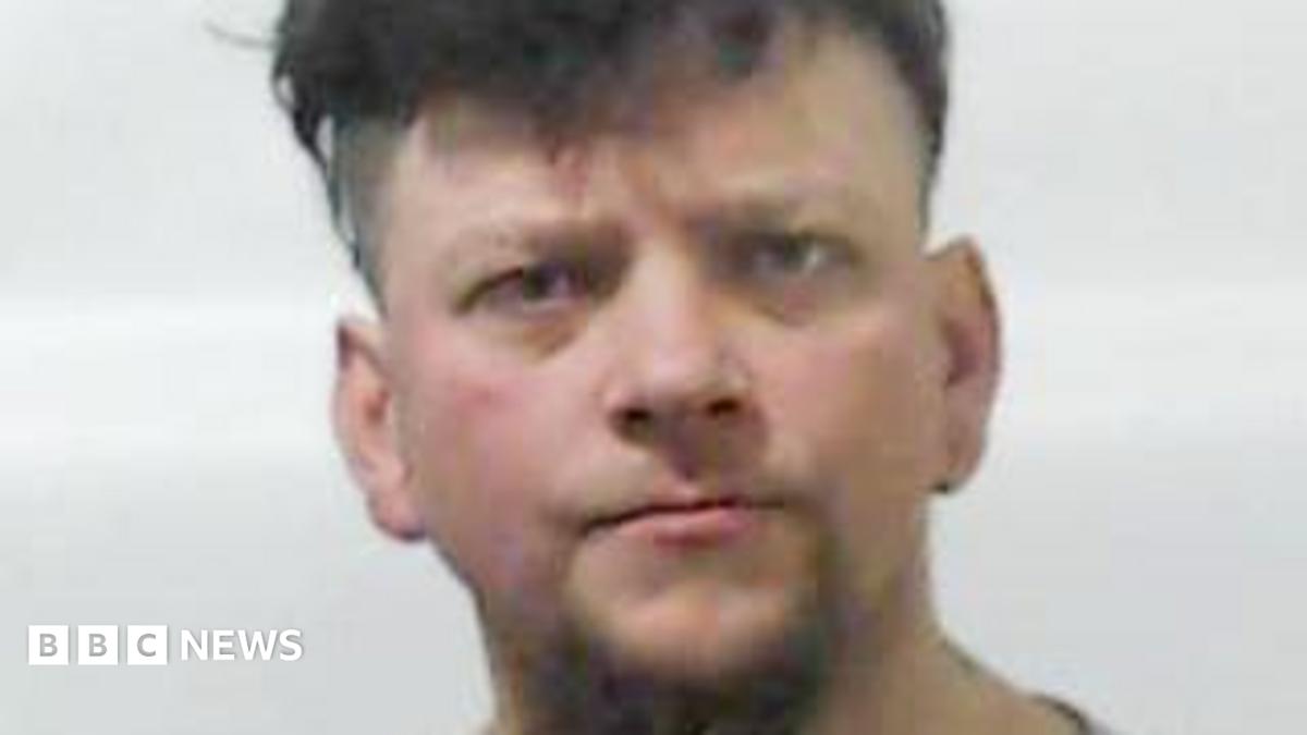 Man who murdered stepmother's ex and ate finger jailed for life