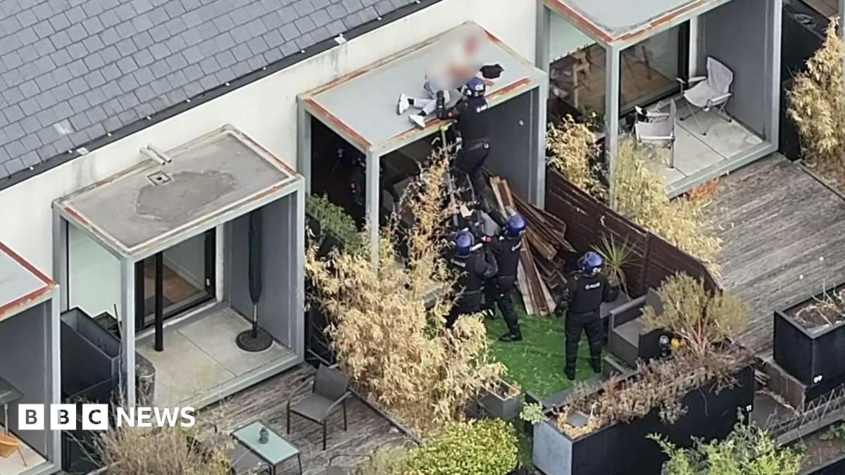 Watch moment police arrest wanted man while he slept on roof