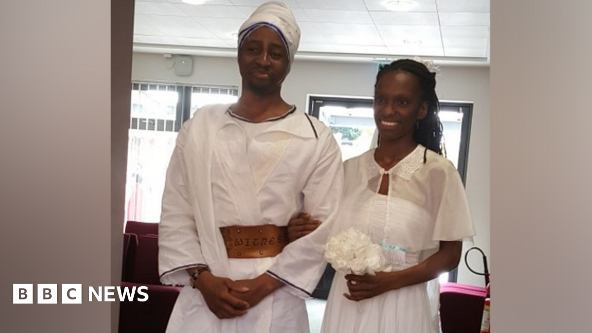 Tai and Naiyahmi Yasharahyalah on their wedding day wearing white clothes