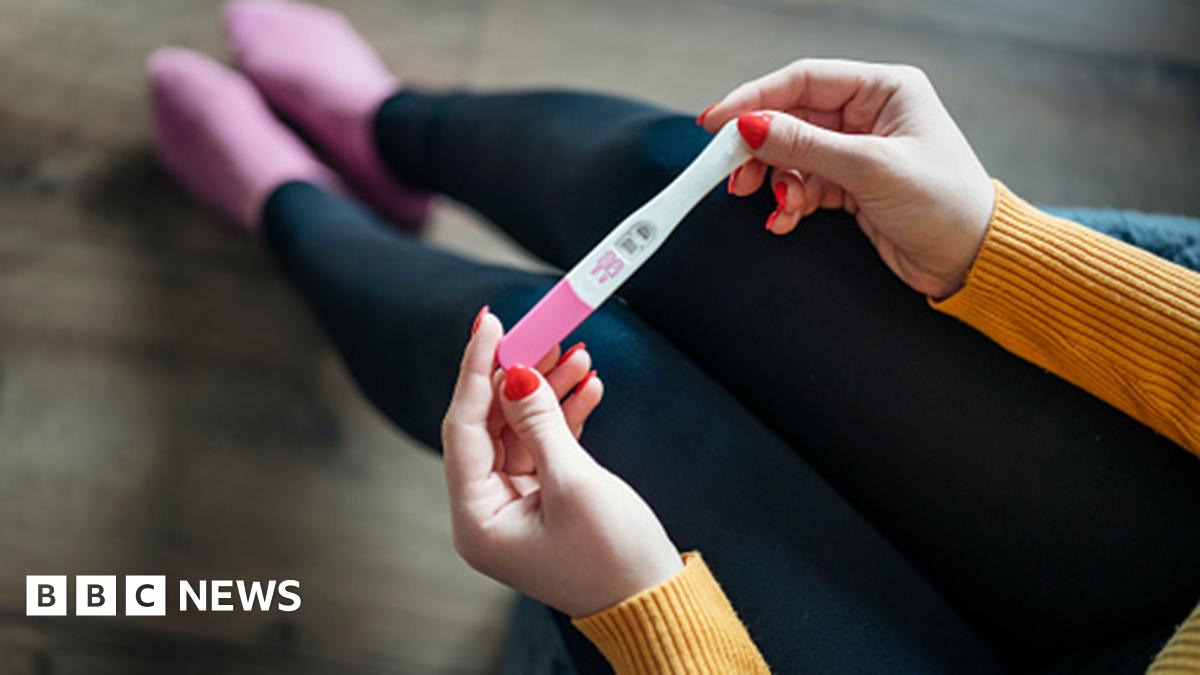 Anonymous woman with positive pregnancy test at home