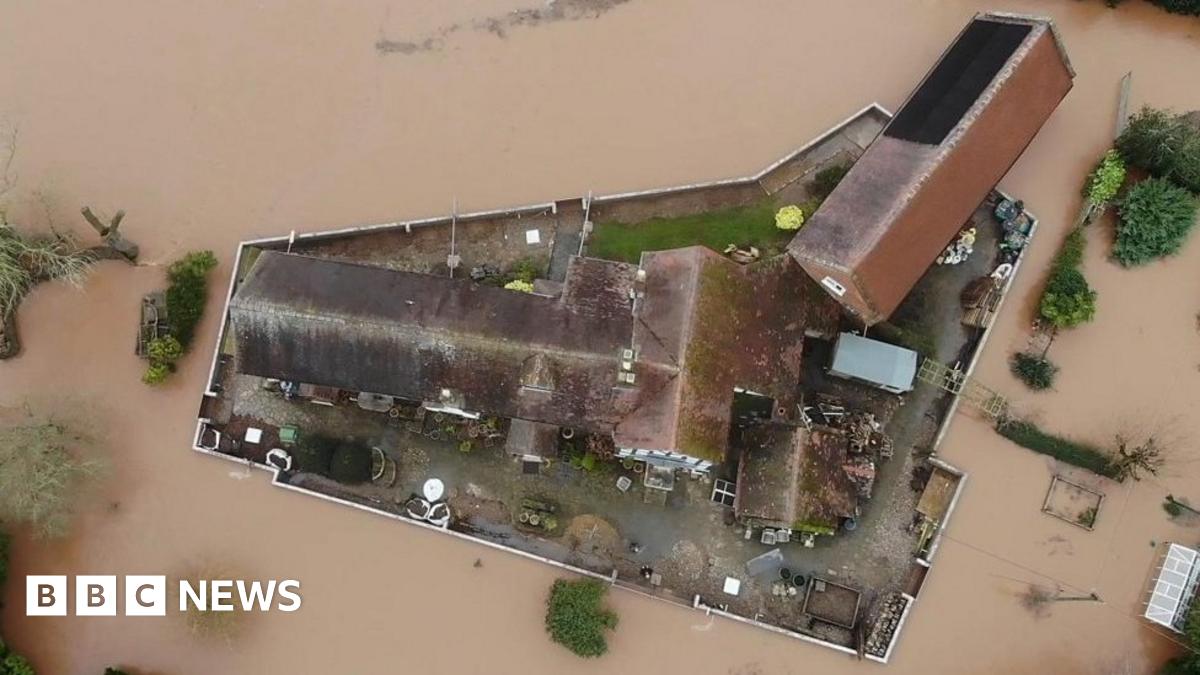 A wall circling Nick Lupton's property protects it against floods