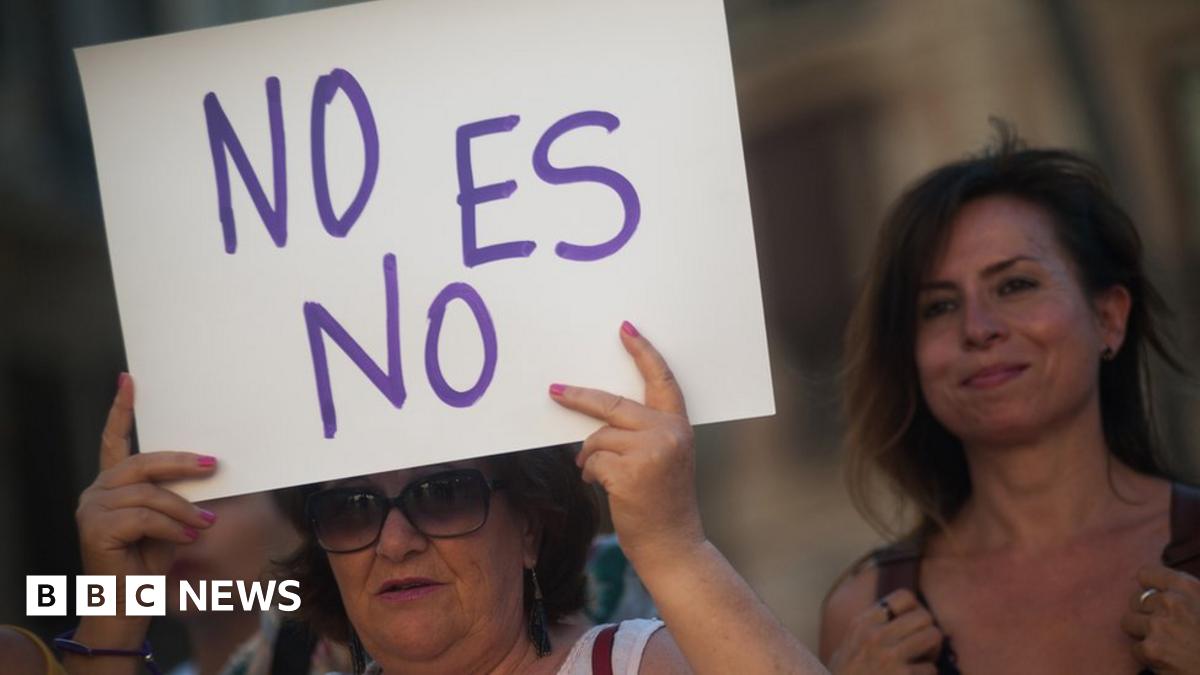 A woman holds a placard during a protest against sexual violence in Malaga, Spain, 21 June 2019