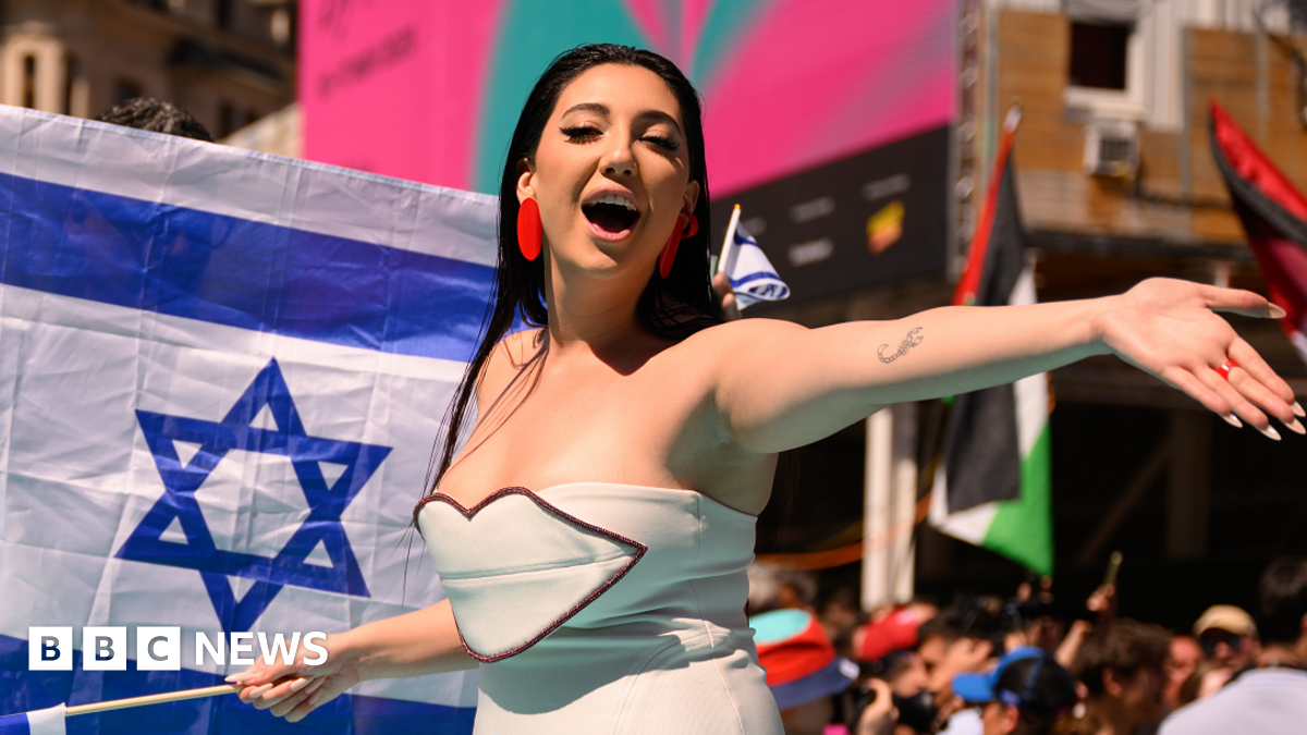Israel's Yuval Raphael posing on the turquoise carpet during the opening ceremony of the 69th Eurovision Song Contest in Basel, Switzerland