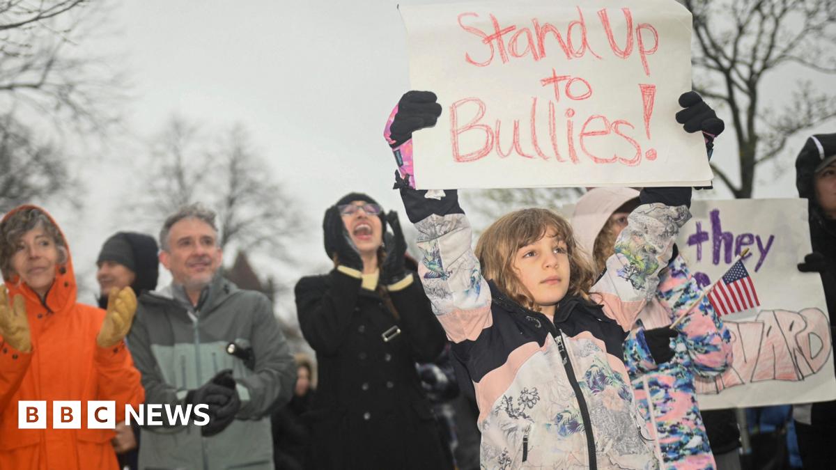 Protesters rally in support of Harvard University