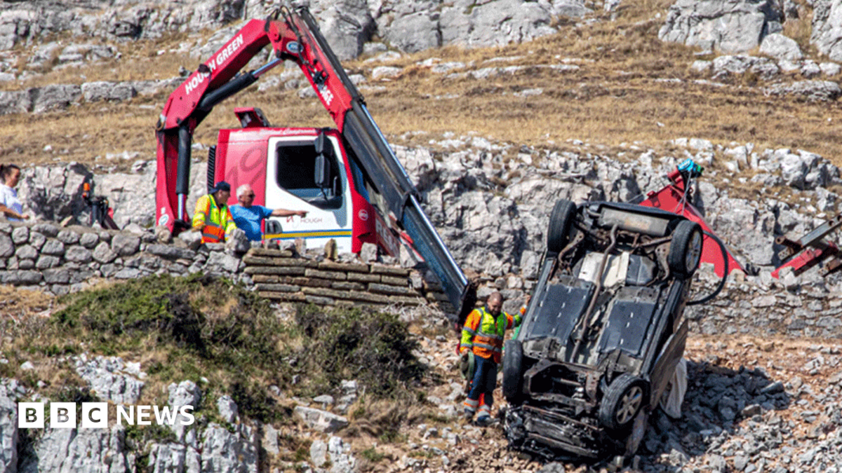 Car flips and plunges off steep cliff after driver seen ploughing through walls and fences