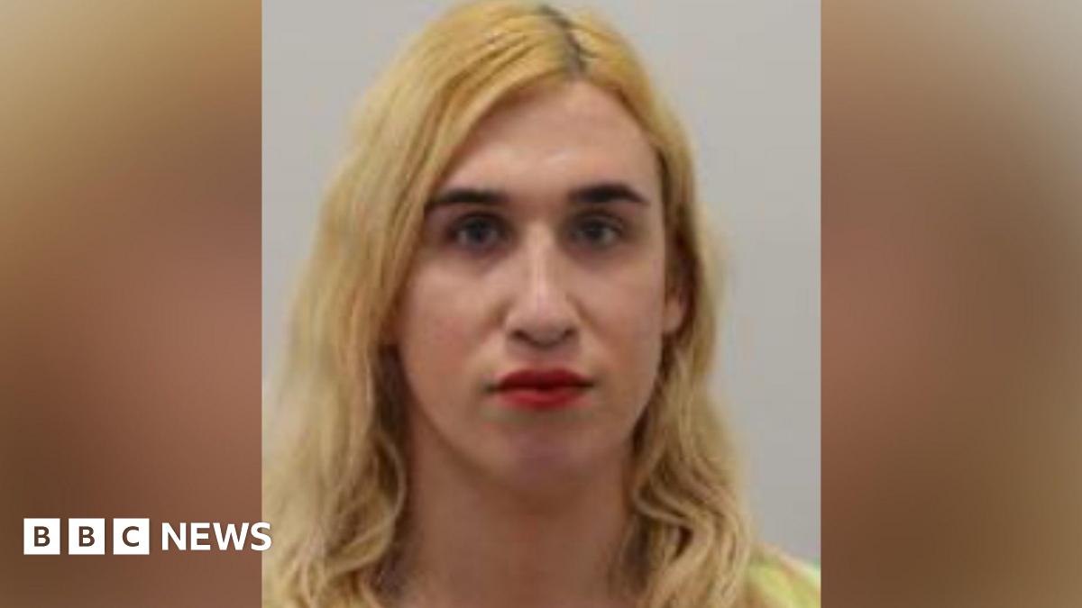 A police mugshot of Vivienne Taylor, who has long blonde hair, a yellow top and red lipstick