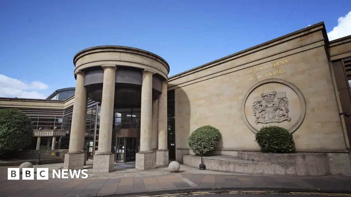 The front of the High Court building in Glasgow with four columns at the entrance
