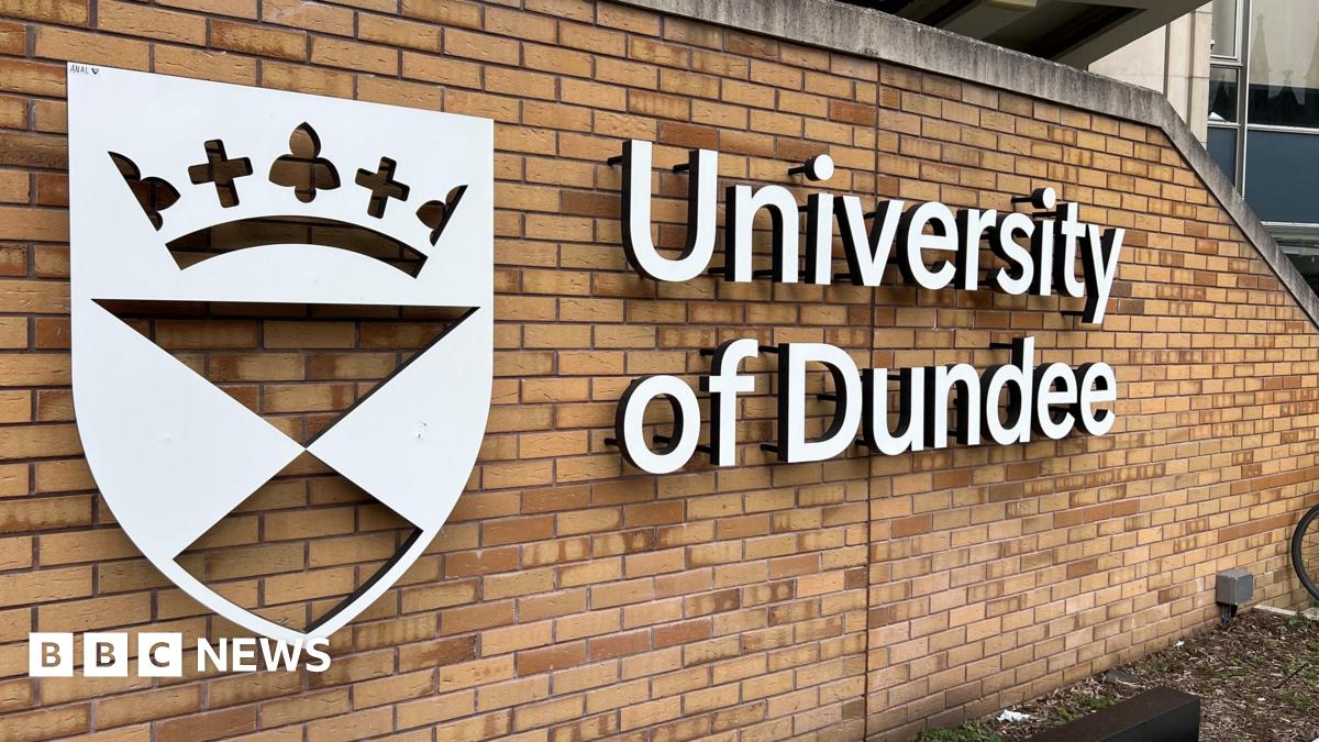 The University of Dundee logo in white letters on a brick wall