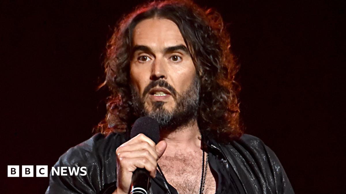 Russell Brand appears in court via videolink charged with further sex offences